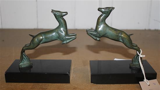 A pair of French Art Deco patinated bronze deer bookends, 5in.